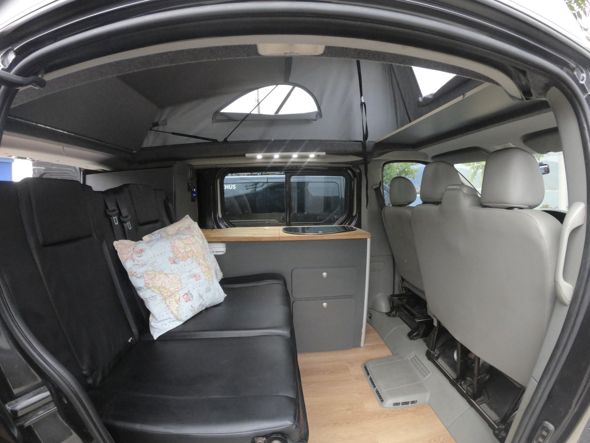 Back seat and kitchen area of Opel camper